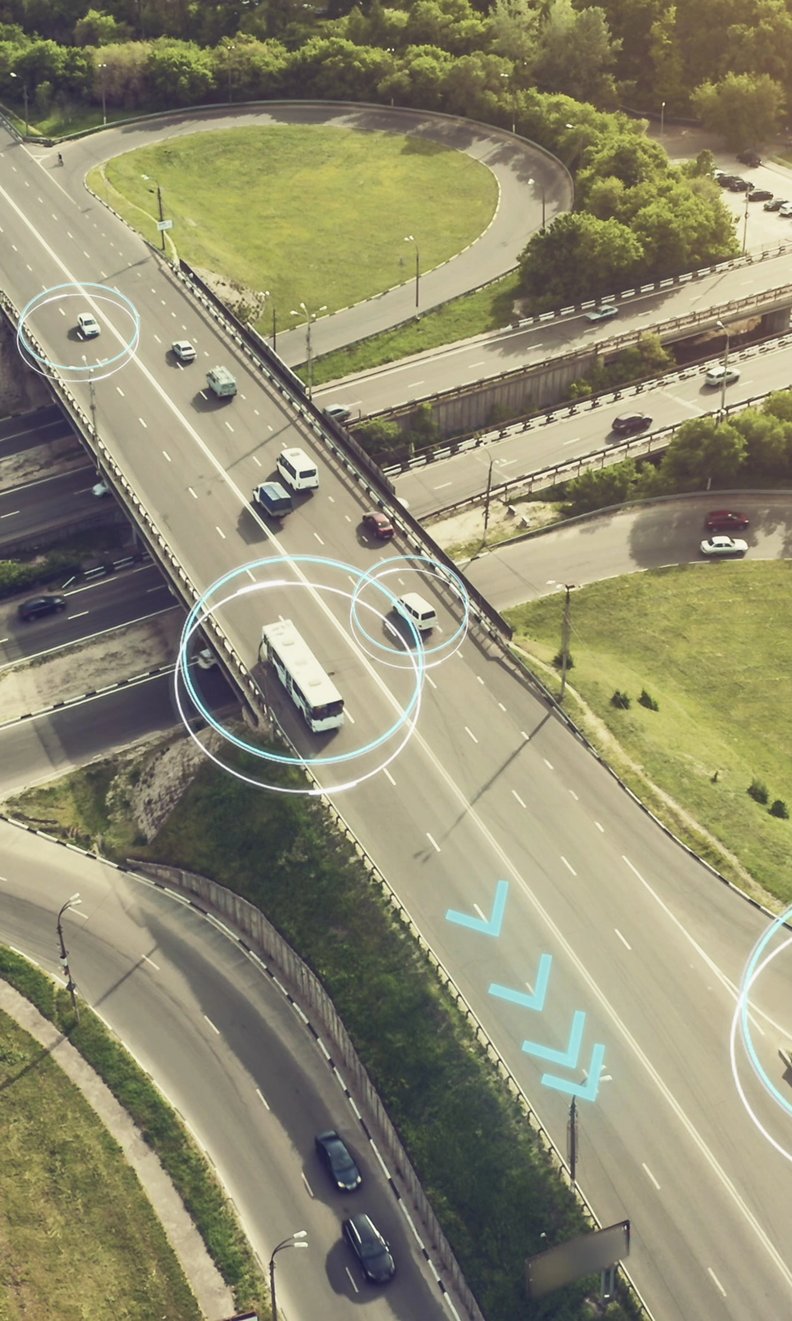 Aerial view of a highway interchange with marked autonomous vehicles.