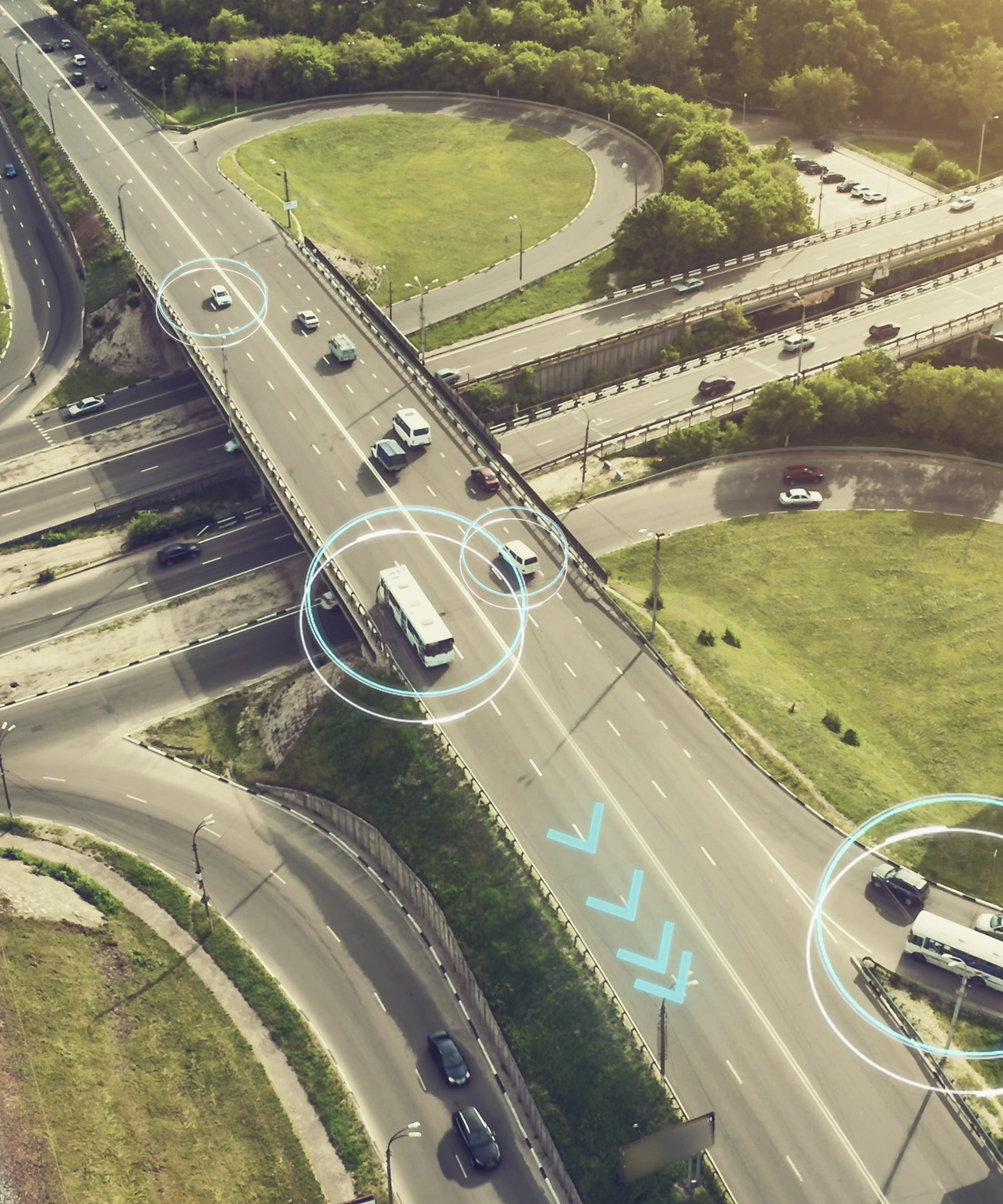 Aerial view of a highway interchange with marked autonomous vehicles.