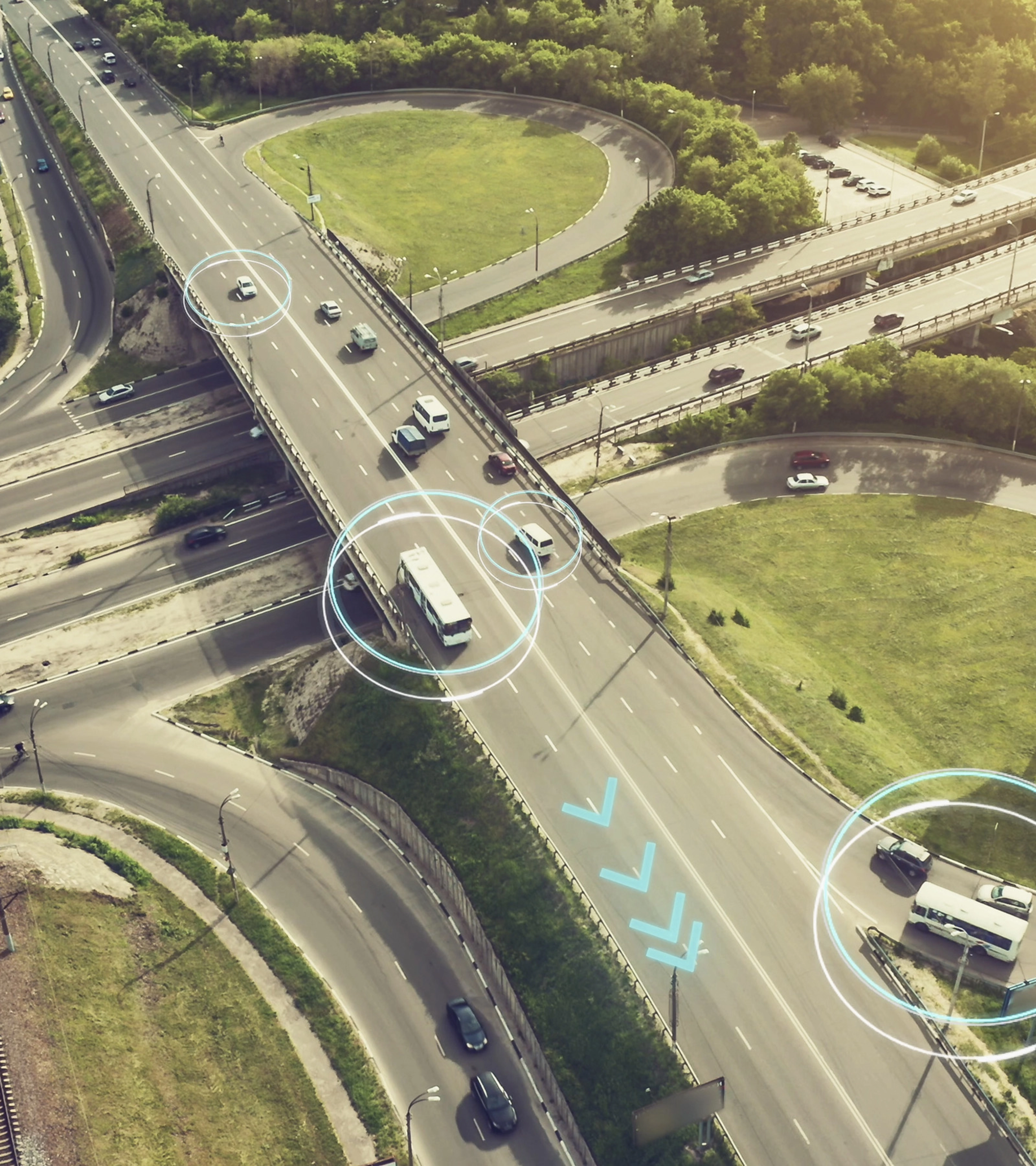 Aerial view of a highway interchange with marked autonomous vehicles.